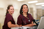 Two Nurses at Station at Hospital